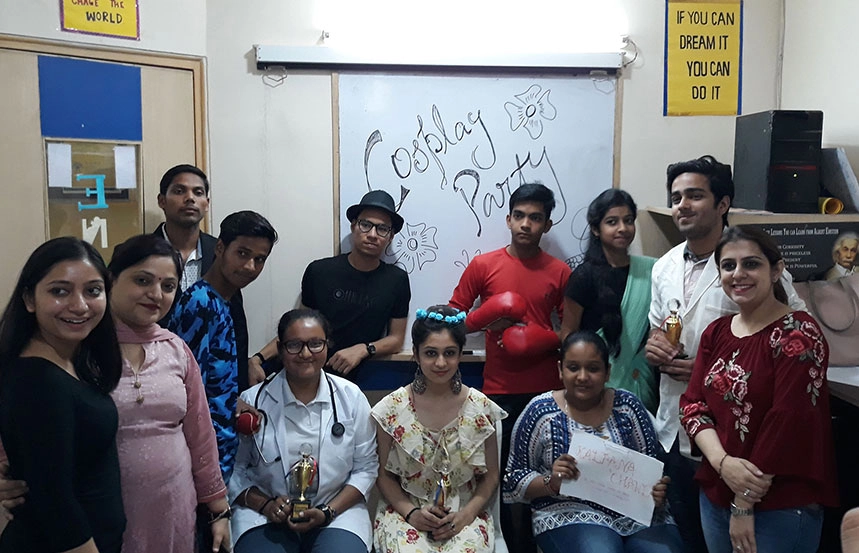 Students enjoying a fun cosplay party inside the classroom with creative costumes.