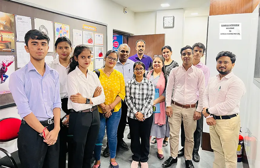 Formal group photo of faculty and students after an interview session