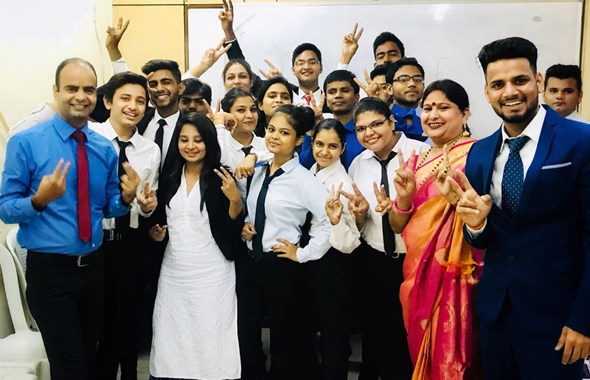 Smiling students relax together after class session ends