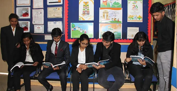 Students preparing for interviews in formal dress