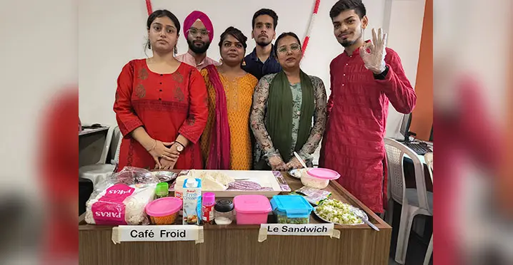 Students presenting food items at Diwali stall